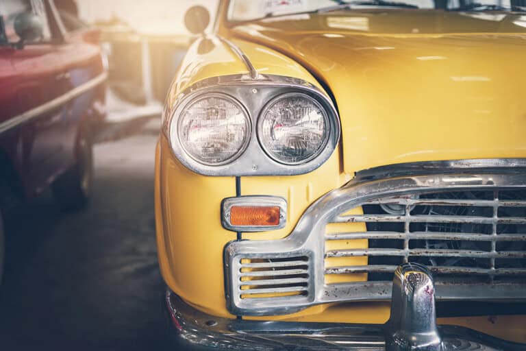 close up headlight of yellow retro classic car 2025 03 05 02 55 57 utc 768x512